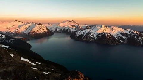 Mountain ocean views snow sunset timelapse Stock Footage 75736557