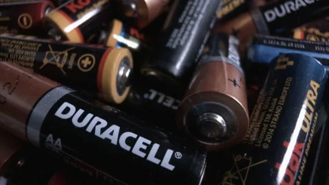 Mountain of old alkaline batteries of different brands.  Stock Footage 162372689