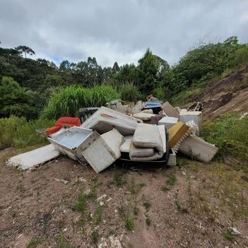 Mountain of old sofas and mattresses Stock Photos