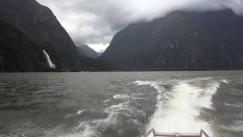 Mountain panorama and water surface view from boat in New Zealand. Stock Footage