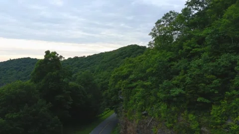 Mountain pass road aerial view at sunset Stock Footage 328964275