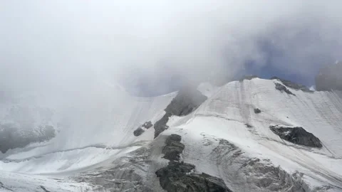 A mountain pass view among the white clouds and blue sky. Scenic cloudy Stock Footage 169745647