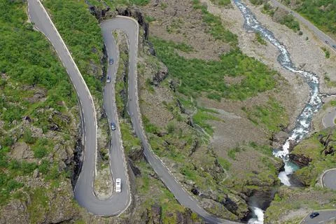 Mountain pass in Zig Zag serpentines barren mountains wild stream narrow 写真素材