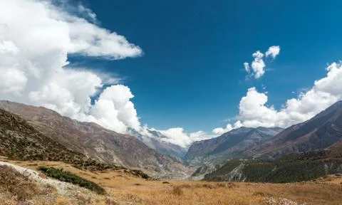 Mountain pastures with dramatic sky. Stock Photos