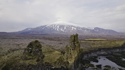 Mountain With Patches of Snow, Stone Structure by the Calm Sea Waters Stock Footage 157372924