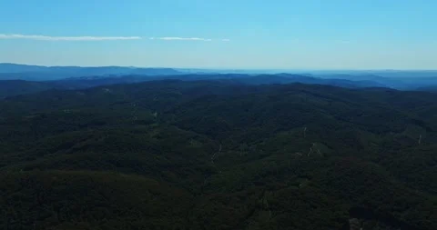 Mountain Paths Layers Of Green Forests Wind Turbines Spinning In The Far 스톡 동영상 300448077
