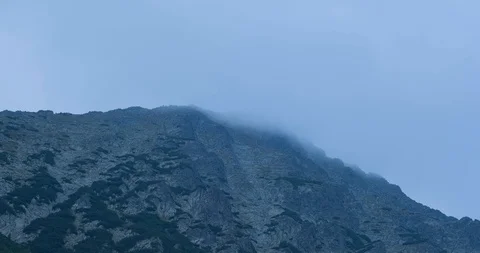 Mountain peack  in fog Stock Footage 121087323