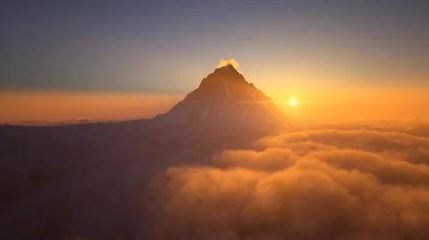 Mountain peak above the clouds Stock Illustration