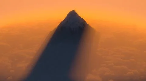 Mountain peak above the clouds Stock Illustration