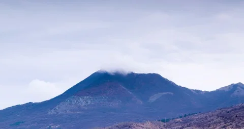 Mountain peak and clouds timelapse footage at dawn Stock Footage 98486573