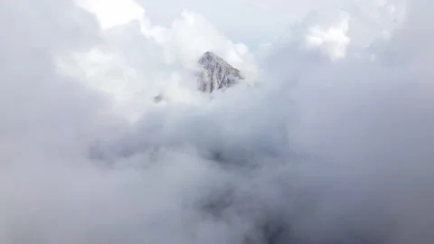 Mountain peak behind clouds in the Brenta Dolomites Stock Footage 224542135