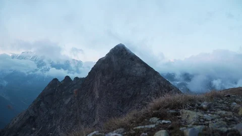 Mountain peak in Chamonix with clouds passing by, 4K Stock Footage 129611024