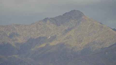 Mountain Peak with cloud shadows in Queenstown Stock Footage 159745673
