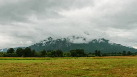 A mountain peak in the clouds Stock Footage 154930551