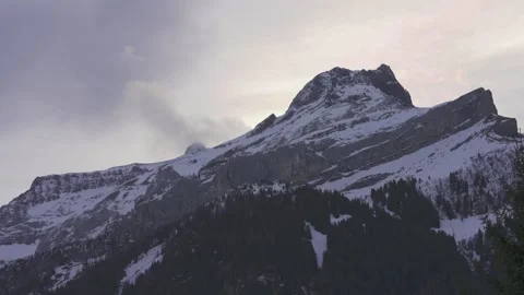 Mountain peak with clouds on summit Stock Footage 327619438