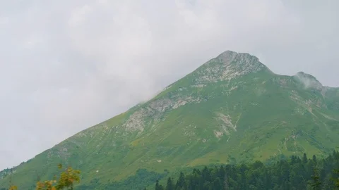Mountain peak covered with clouds in Rosa Khutor. View from chair lift moving Stock Footage 95412878
