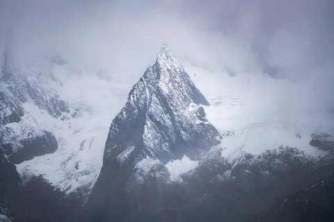 Mountain peak covered in snow Stock Photos