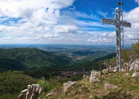 Mountain peak with cross and dramatic light Stock Photos