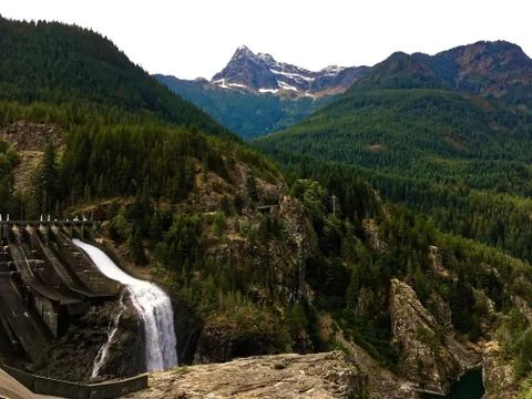 Mountain peak with a dam in the foreground Stock Photos