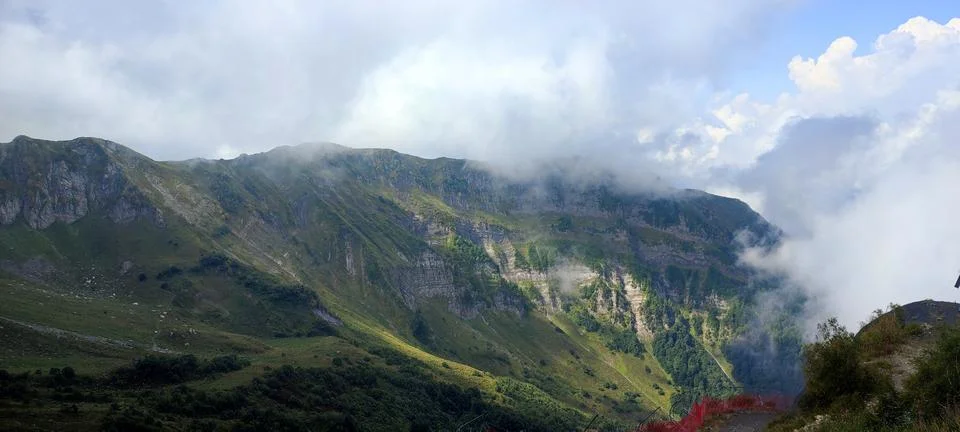 Mountain peak enveloped in clouds, creating majestic atmosphere for adventu.. Stock Photos