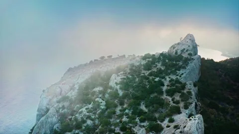 Mountain peak filmed through the clouds, on the paths for hiking can be seen the Video stock 218404172