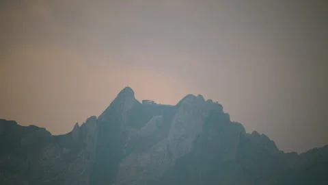 Mountain peak near Lucerne partially covered by clouds  Stock Footage 325685953