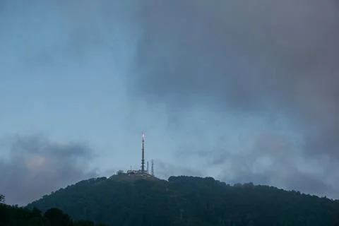Mountain peak with rain clouds over the tower Stock Photos