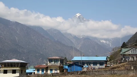 Mountain peak rises above clouds near Lukla in Himalayas Nepal 스톡 동영상 101443482