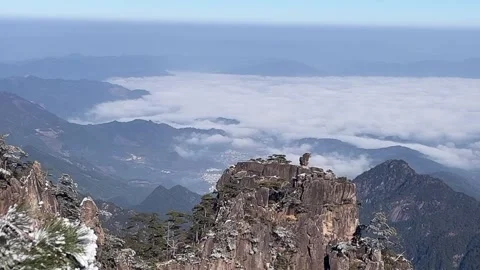 Mountain Peak with Sea of Clouds and Valley Village View Horizontal Video Stock Footage 326022193