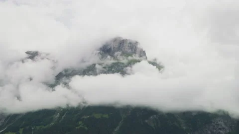 Mountain peak shrouded in clouds Stock Footage 219060170
