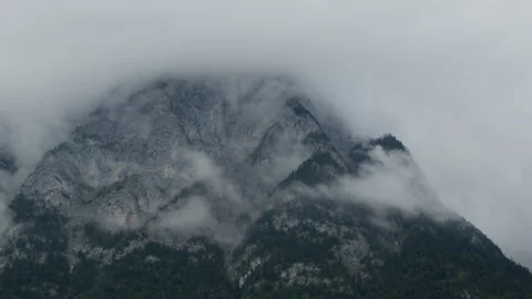 Mountain peak shrouded in clouds Stock Footage 270069056