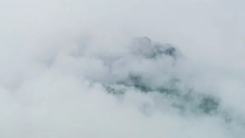 Mountain peak shrouded in clouds, timelapse Stock Footage 219722042