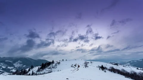 Mountain peak with snow blow by wind. Winter landscape. Cold day, with snow. Stock Footage 154222596