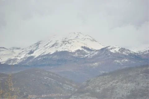 Mountain peak in snow cloud Stock Photos