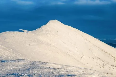 Mountain peak in snow Stock Photos