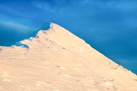 Mountain peak in snow Stock Photos