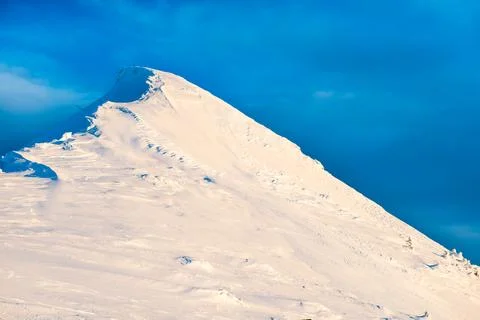 Mountain peak in snow Stock Photos