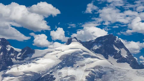 Mountain peak in a snow, time lapse scene Stock Footage 169244825