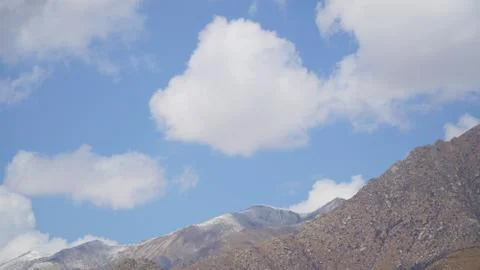 Mountain peak with some clouds and clear blue sky Foto stock