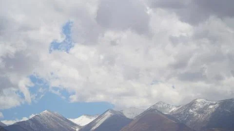 Mountain peak with some clouds and clear blue sky Foto stock
