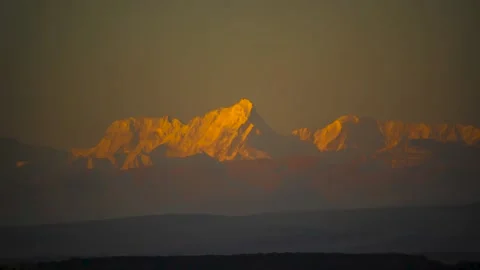 Mountain peak in sunlight at dawn Video stock 151424956