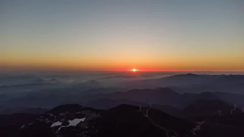 Mountain Peak Sunrise Time-lapse with Golden Dawn and Horizon Glow Stock Footage 326679135