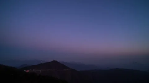 Mountain Peak Sunset Time-lapse with Vibrant Orange Sky and Sun Sinking Stock Footage 326684887