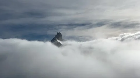 Mountain peak under the clouds and fog in French alps by winter Video stock 336960586