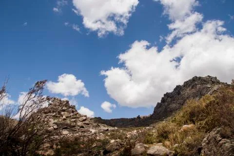 Mountain peak uphill under cloudy sky Stock-Fotos