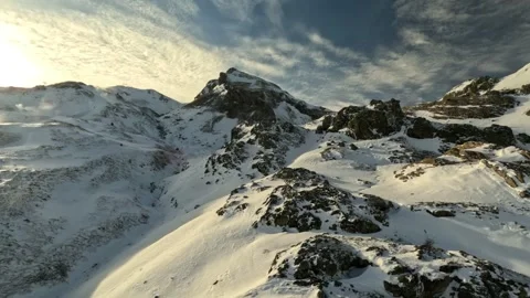 Mountain peak view covered in snow in Spain, Cinematic FPV drone Stock Footage 288092213