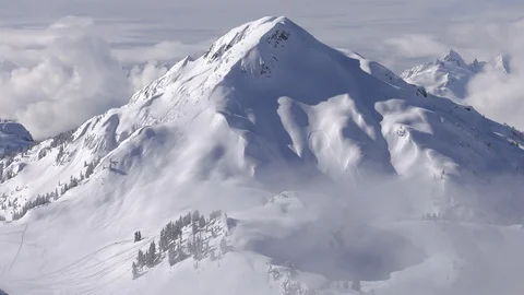 Mountain peak in Whistler, Canada on a partly cloudy day. Stock Footage