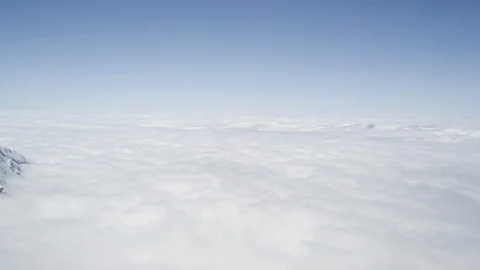 Mountain peaks above the clouds Stock Footage 113247942