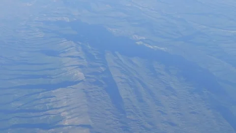 Mountain peaks and clouds seen from above Stock Footage 290094386
