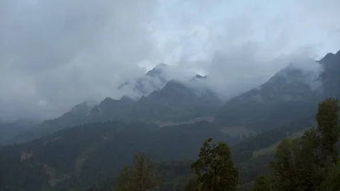 Mountain peaks with blue sky and dramatic clouds Stock Footage 97722286